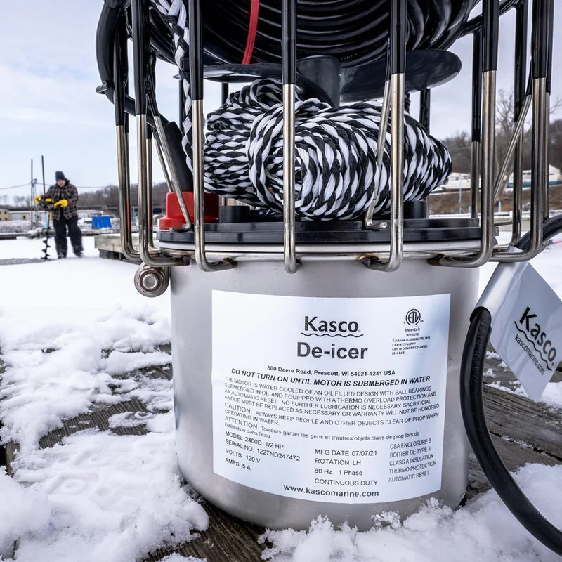 Kasco 2400D de-icer photographed on a snowy dock